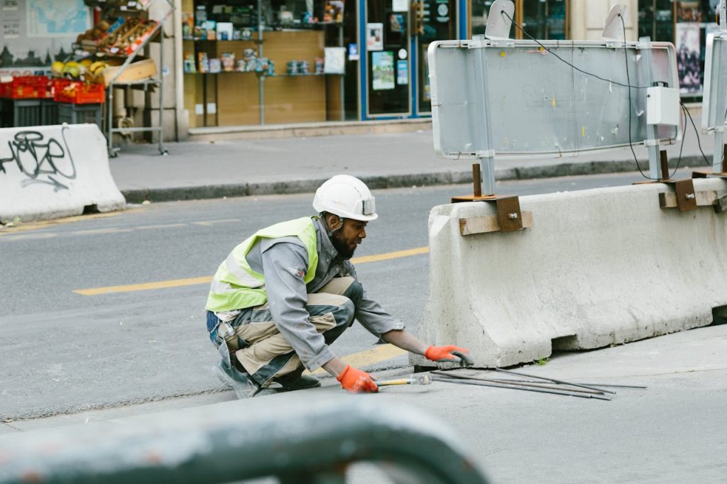 The Entrepreneur’s Guide to Turning Ideas Into Profitable A construction worker operates on a city street in Paris, France, showcasing urban development.